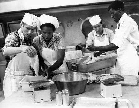 Rob Corcoran (Scotland) and Nombulelo Ndamse (South Africa) concentrate on preparing food